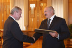 The official letter of thanks of the President of the Republic of Belarus is given to Finance Minister Andrei Kharkovets