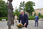 During a ceremony to place a symbolic flower basket at the memorial to the victims of Holodomor