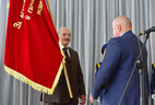 Alexander Lukashenko gives OAO Savushkin Product the Honorary State Banner of the Republic of Belarus for the economic excellence