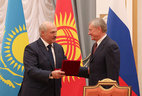 Belarus President Alexander Lukashenko presents a CSTO honorary distinction first class to Nikolai Bordyuzha