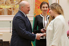 Alexander Lukashenko presents the Order of Mother to chief economist of OOO CountryMilk, Kobrin District, Natalya Kanko