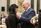 Alexander Lukashenko presents the Order of Mother to worker of OAO Belaruskali Olga Telenchenko
