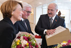 Belarus President Alexander Lukashenko gives presents to German President Frank-Walter Steinmeier and his spouse