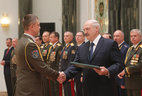 Graduate of the Command and Staff Department of the Military Academy Yuri Gornovsky receives a commendation letter from the President