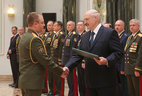 Graduate of the Marshal Semyon Budyonny Military Signals and Communications Corps Academy at the Russian Defense Ministry Vyacheslav Kovalchuk receives a letter of commendation from the President