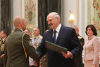 Graduate of the Command and Staff Department of the Military Academy Andrei Razvodovsky receives a letter of commendation from the President