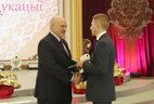 Viktor Tsvetkov, the head of the information and communication technologies department at the Belarusian State University of Informatics and Radioelectronics, receives a commendation letter from the President
