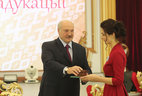 Anna Zankevich, a graduate of the Institute of Social Science and Humanities Education at the Belarus State Economic University, receives a commendation letter from the President