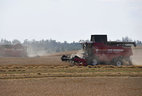 After hearing out reports on the progress with harvesting, the president approached a Palesse GS12 A1 combine harvester