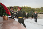 Belarus President Alexander Lukashenko lays flowers at the monument to independence and humanism in Tashkent