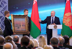 The painting of cosmonaut Alexey Leonov is presented to Belarus President Alexander Lukashenko