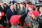 Belarus President Alexander Lukashenko and Tajikistan President Emomali Rahmon visit the tractor assembly plant in Hisor
