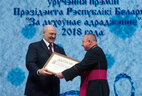 Aleksandr Lukashenko presents the award For Spiritual Revival to Yan Kremis, head of the section for the translation of liturgical texts and official documents of the Catholic Church of the Congregation for Divine Worship and the Discipline of the Sacraments under the aegis of the Conference of Catholic Bishops of Belarus