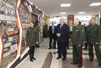 Belarus President Aleksandr Lukashenko tours the military history exhibition hall at the Military Academy