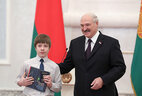 Aleksandr Lukashenko presents a passport to student of Minsk gymnasium No. 29 Matvei Kvyatkevich